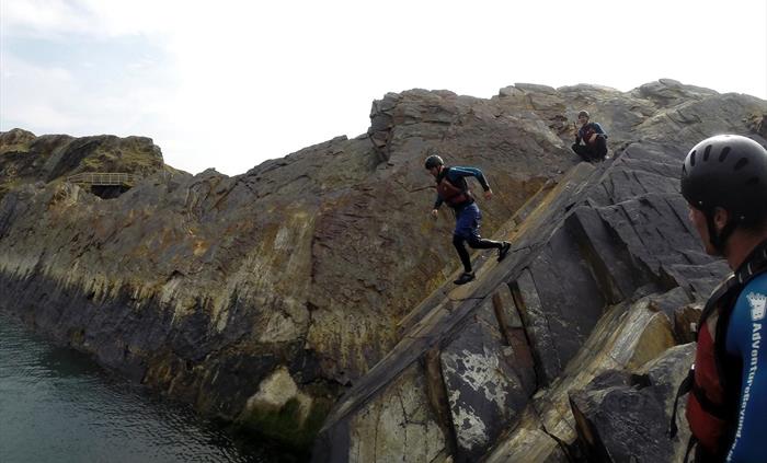 Coasteering at Abereiddy running down the slab